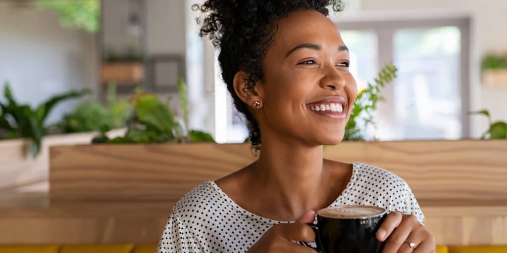 woman drinking Coffee with oat milk